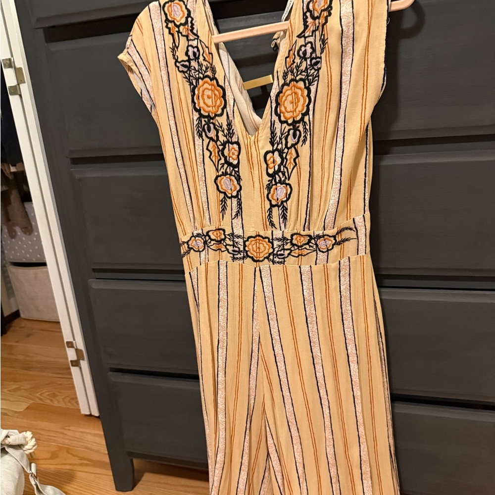 Elegant Backless Romper with Floral Accents